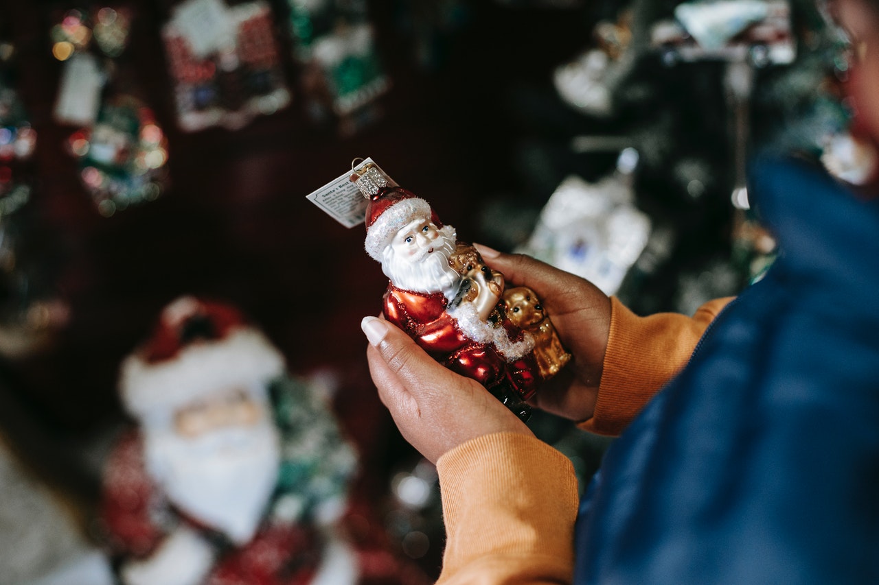 person examining christmas ornament