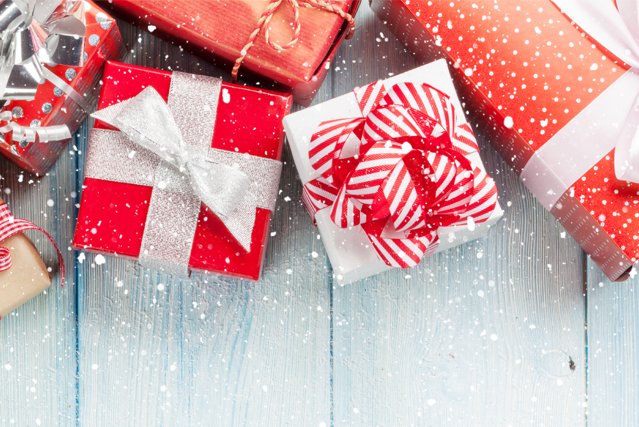 red wrapped presents on a wooden background