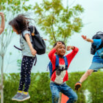 colorful picture of children jumping for joy